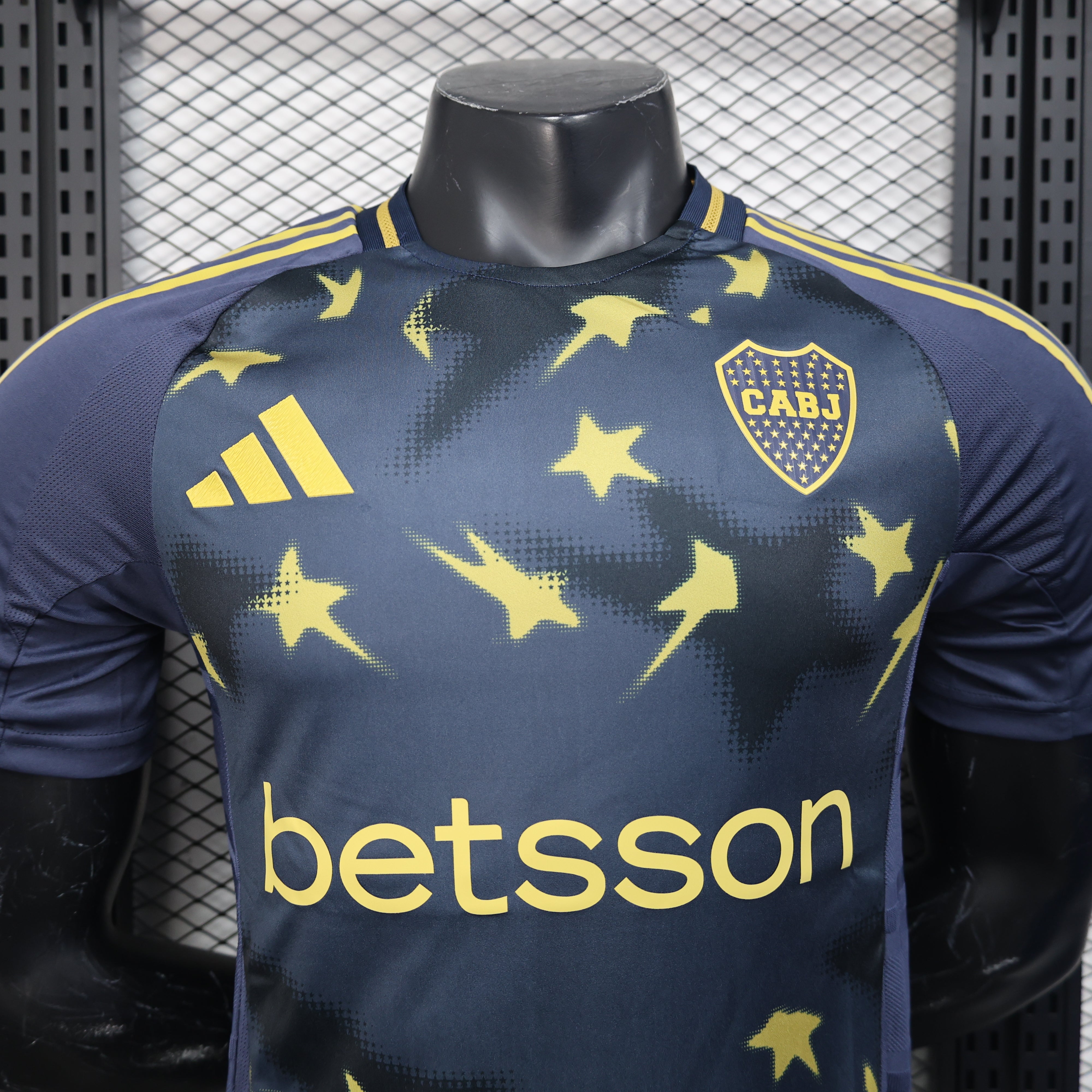 Dark blue Boca Juniors 25/26 third player jersey with yellow star bolt patterns, adidas logo