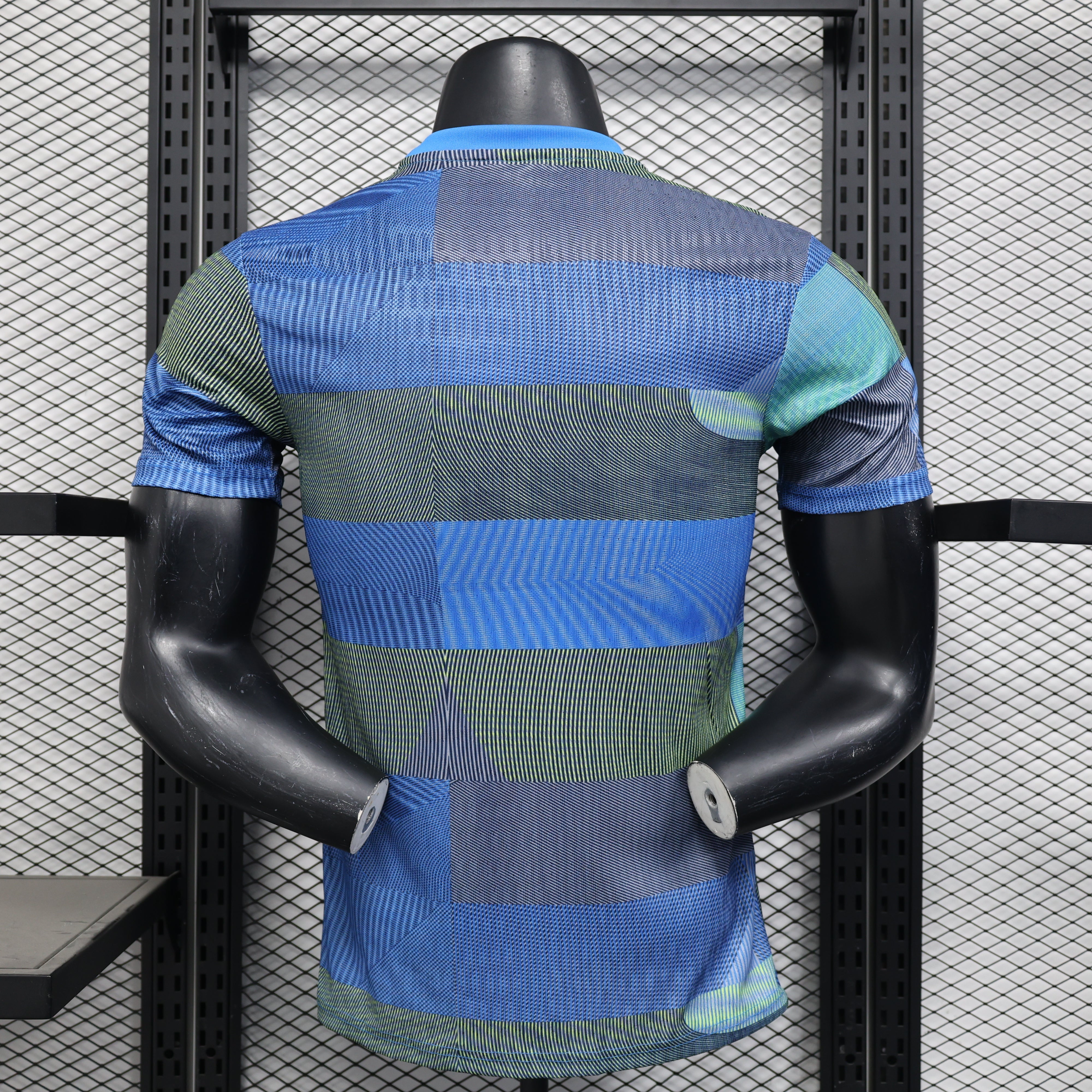 Blue and green striped Real Madrid 25/26 player training polo shirt