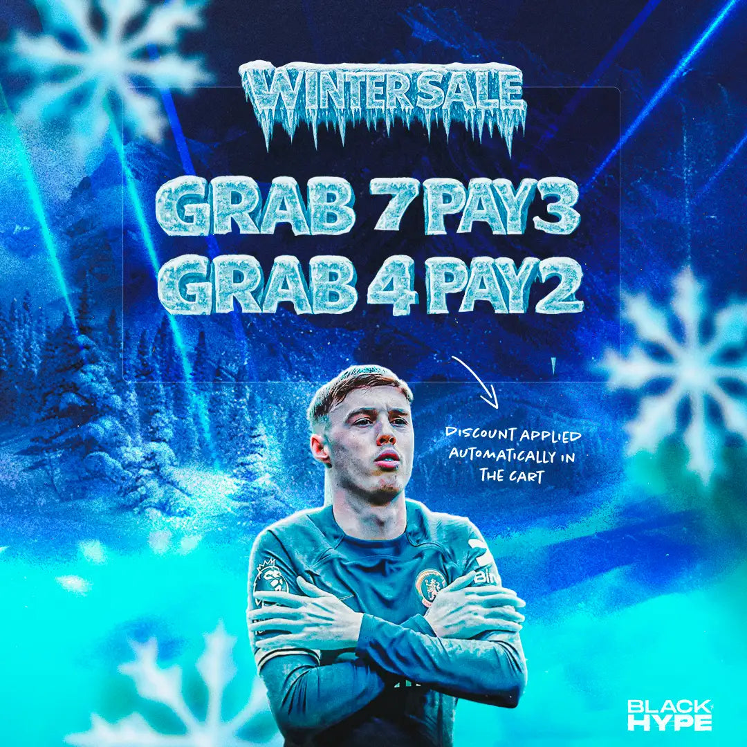 A young man in a teal chelsea fc jersey with arms crossed, standing against an icy blue winter-themed background.