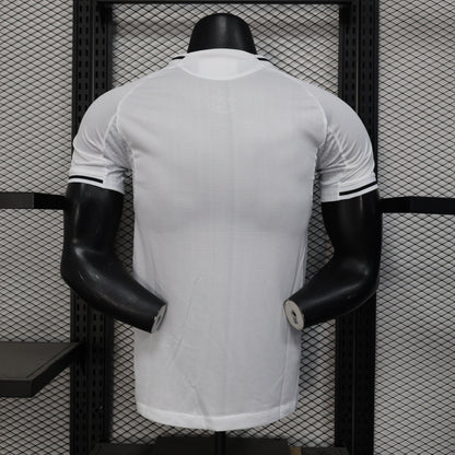 White New Castle 25/26 home player jersey with black trim on mannequin