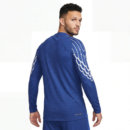 Blue long-sleeved PSG 25/26 4th away jersey with white wing graphics